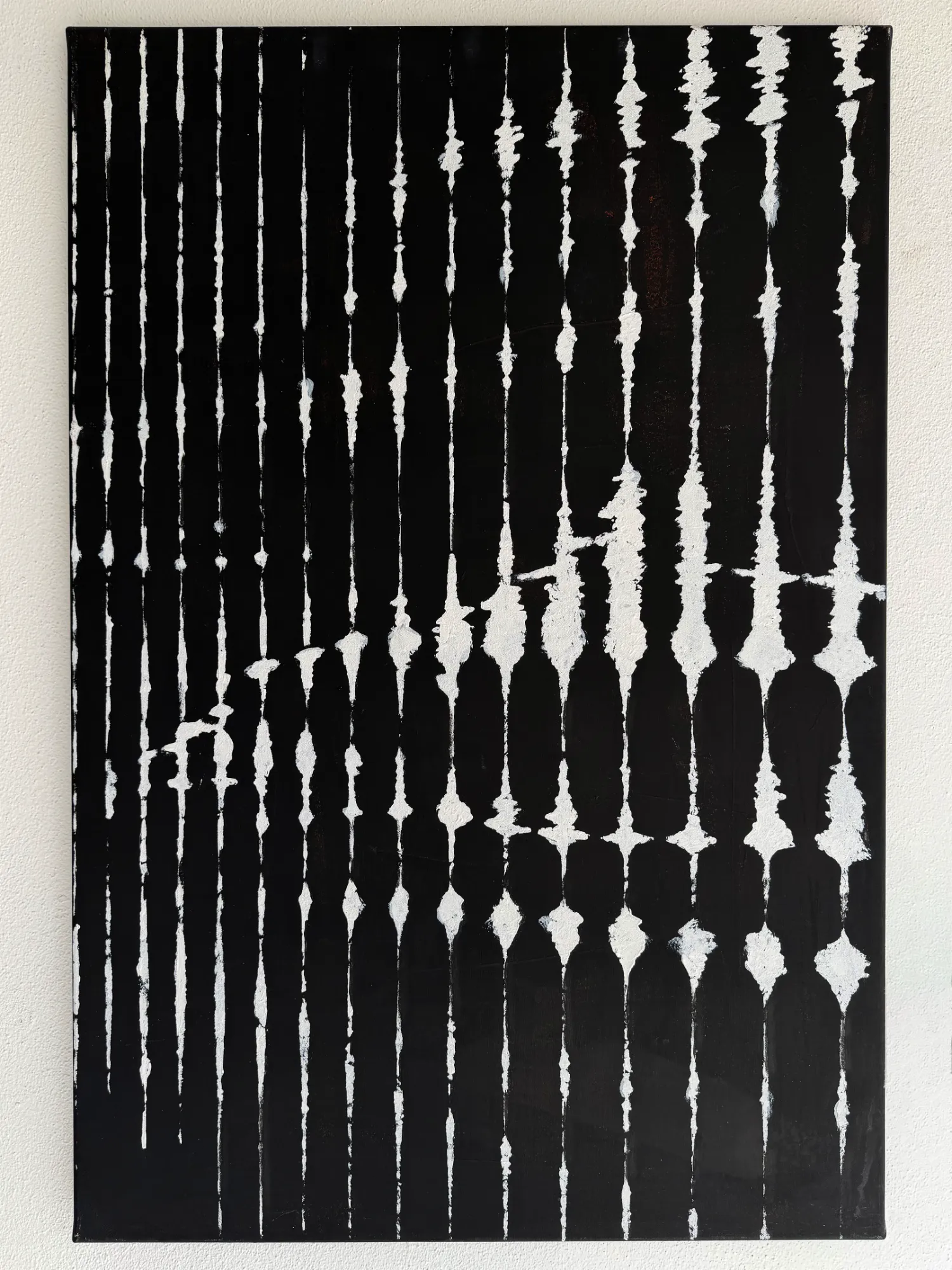 Front view of Tribal anamorphic painting showing abstract white lines on a black background