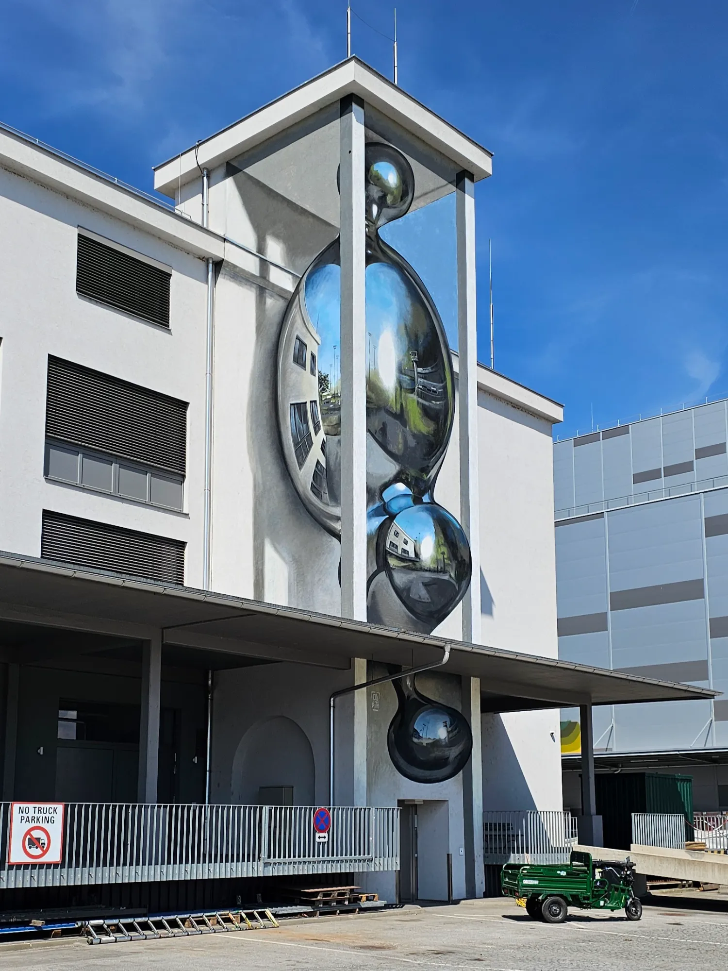 Odeith anamorphic chrome drop mural at Mural Harbor in Linz, Austria